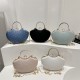 Wholesale small Chanel-style hand-held fan-shaped women's bags, 2025 summer new light luxury and fashionable single-shoulder bags, trendy chain crossbody bags Wholesale small Chanel-style hand-held fan-shaped women's bags, 2025 summer new light luxury and fashionable single-shoulder bags, trendy chain crossbody bags