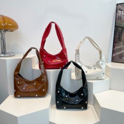 Wholesale of niche design rivet hand-held small handbags for women in Spring 2025, versatile single-shoulder bags for commuting and underarm bags
