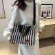 Commuter large-capacity hand-held tote bag for women, new 2024 autumn and winter collection, personalized striped single-shoulder bag, trendy casual crossbody bag Commuter large-capacity hand-held tote bag for women, new 2024 autumn and winter collection, personalized striped single-shoulder bag, trendy casual crossbody bag