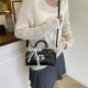 Wholesale Korean version light luxury hand-held small square bags, women's bags, 2025 summer new fashion lock button single-shoulder bags, commuting crossbody bags Wholesale Korean version light luxury hand-held small square bags, women's bags, 2025 summer new fashion lock button single-shoulder bags, commuting crossbody bags