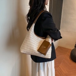 The new summer beach bag is stylish and versatile, the commuter tote bag is fashionable and ethnic-style, and it is a grass-woven underarm bag or handbag