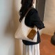 The new summer beach bag is stylish and versatile, the commuter tote bag is fashionable and ethnic-style, and it is a grass-woven underarm bag or handbag