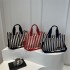 Commuter large-capacity hand-held tote bag for women, new 2024 autumn and winter collection, personalized striped single-shoulder bag, trendy casual crossbody bag