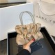 The new candy-colored pleated small square bag for women in the autumn of 2023 is a fashionable and fresh water diamond bag. It's a stylish single-shoulder crossbody bag