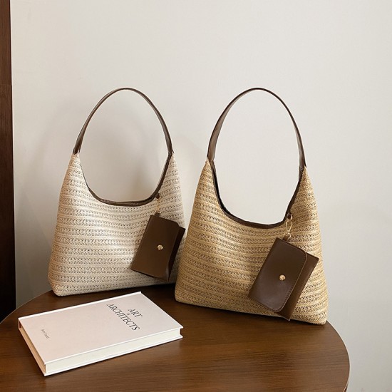 The new summer beach bag is stylish and versatile, the commuter tote bag is fashionable and ethnic-style, and it is a grass-woven underarm bag or handbag
