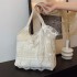 The 2025 summer new fairy tote bag with a chic texture and a casual sweet style is a versatile handbag