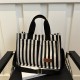 Commuter large-capacity hand-held tote bag for women, new 2024 autumn and winter collection, personalized striped single-shoulder bag, trendy casual crossbody bag Commuter large-capacity hand-held tote bag for women, new 2024 autumn and winter collection, personalized striped single-shoulder bag, trendy casual crossbody bag